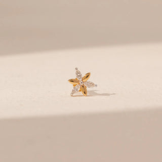 Front view of a 14KT yellow gold floral diamond nosepin, featuring alternating gold and marquise-cut lab-grown diamond petals.