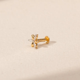Side view of a 14KT yellow gold floral diamond nosepin, featuring alternating gold and marquise-cut lab-grown diamond petals.