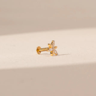 Angled view of a 14KT yellow gold floral diamond nosepin, featuring alternating gold and marquise-cut lab-grown diamond petals.