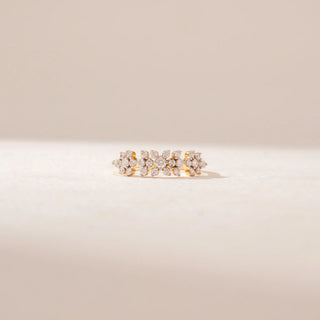 Front view of a 14KT Yellow Gold diamond ring featuring a floral cluster design with round diamonds arranged in a row.