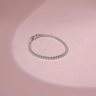 Top view of a 14KT White Gold diamond bracelet featuring a continuous row of rectangular diamond accents.