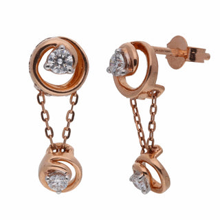 A close-up front view of an female earring with an intricate design on a white background showcasing a rose gold setting with two round diamond studs, one to be set on the earlobe and another dangling below secured through a bombay screw. The earring has a total carat weight of 0.37 carats of lab-grown diamonds set in 14 KT rose gold and the weight being 2.74 grams.