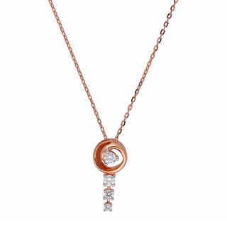 A close-up front female view of a necklace of size 16 secured through a spring lock on a white background, featuring a delicate 14 KT rose gold chain with a dangling pendant design. The pendant consists of a round brilliant-cut lab-grown diamond stud, suspending additional smaller round brilliant diamonds below, totalling 0.29 carats. The necklace showcases an elegant and minimalist style with a total weight being 2.63 grams.