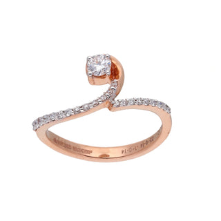 A side view of a ring of a size 12, on a white background, featuring an elegant infinity-inspired twist design in 14 KT rose gold. It showcases a graceful spiral shape encrusted with pavé-set lab-grown diamonds totalling 0.28 carats and the product weight being 2.41 grams.. The twisted form creates a seamless and feminine look, while the rose gold metal provides a warm, flattering tone complemented by the brilliance of diamond accents.