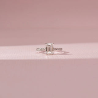 Front view of Emerald-Cut Solitaire Diamond Ring in 14KT White Gold, featuring a rectangular lab-grown diamond and pavé-set band.