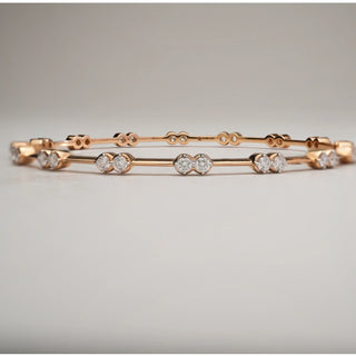 Front view of Blossom Trail Diamond Bangle in 18KT Rose Gold, placed flat on a neutral background, showcasing paired EF-VVS lab-grown diamonds aligned symmetrically along the slim frame.