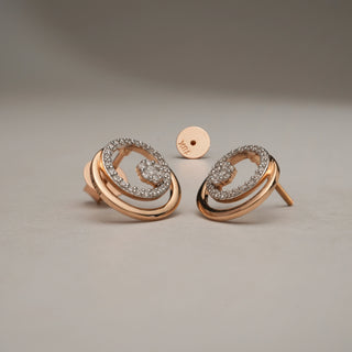 Front view of a 14 KT rose gold drop earring, gross weight 3.34g, showcasing a cluster of 0.450 carats of round EF VVS lab-grown diamonds arranged in a captivating circular design. The earring is presented on a textured light beige fabric.