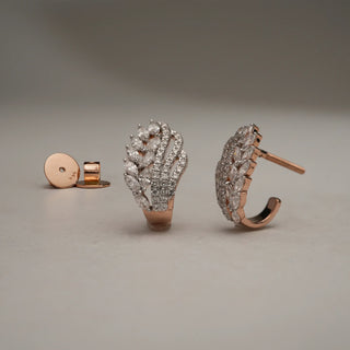 Statement Vine Cluster diamond earrings in 14KT Rose Gold, placed on a neutral surface, featuring layered vine-inspired design with EF-VVS lab grown round and marquise diamond clusters.