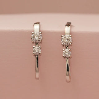 Front view of the 18KT White Gold Modern Diamond Hoop Drop Earrings with two EF VVS round brilliant diamonds each, showcasing a sleek, minimalist design that blends luxury and elegance.
