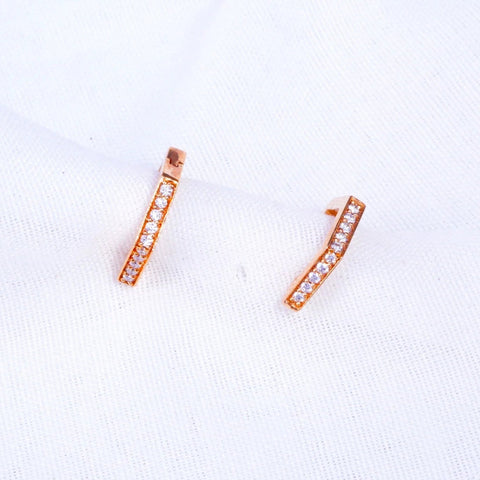 Front view of an elegant piece of jewelry against a crisp white background. Crafted from 14 KT rose gold and weighing 3.56 grams, it features lab-grown diamonds with a total carat weight of 0.19, including a maximum stone size of 0.009 carats. The hinged earwire closure adds a modern touch to its refined design. Known for their ethical sourcing and brilliance, lab-grown diamonds provide the same beauty as mined ones, making this piece perfect for any occasion with timeless style.