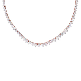 Close-up front view of this exquisite lab-grown female diamond necklace with size 19.5, crafted in 14 KT rose gold features a total diamond weight of 13.54 Carats with a solitaire of 0.54 carats and the weight of the product is 19.47 grams with a spring lock to keep the necklace secured. Each diamond is meticulously set to create a breathtaking display of brilliance. The necklace is showcased on a pristine white background, highlighting its elegance and sophistication.