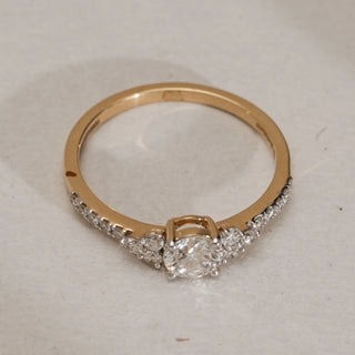 Top view of Reia’s Celeste Solitaire Diamond Ring in 14KT Yellow Gold, showcasing a round EF VVS diamond centre with side accents and pavé band, totalling 0.61 carats.