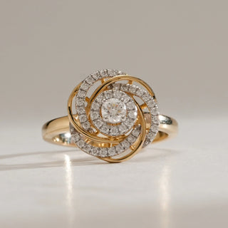 Front view of Diamond Floral Swirl Cocktail Ring in 14KT Yellow Gold, featuring interlaced swirl petals with EF-VVS round diamonds encircling a sparkling central stone.