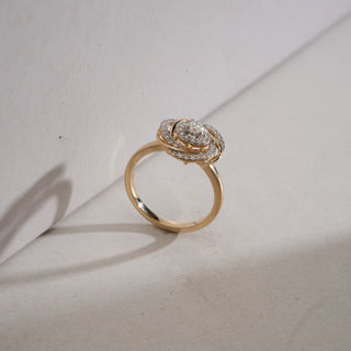 Side view of Diamond Floral Swirl Cocktail Ring in 14KT Yellow Gold, placed against a neutral background, featuring interlaced swirl petals with EF-VVS round diamonds and a central stone.