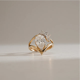 Close-up of the Blooming Teardrop Diamond Ring in 14KT Yellow Gold, showcasing a 2.1 carat pear-shaped centre diamond with marquise floral accents, EF VVS diamonds totalling 2.438 carats.