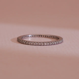 Close-up view of 14KT White Gold Classic Diamond Eternity Band Ring, featuring EF VVS round diamonds in a sleek pavé setting, symbolising timeless love and perfect for stacking elegance.