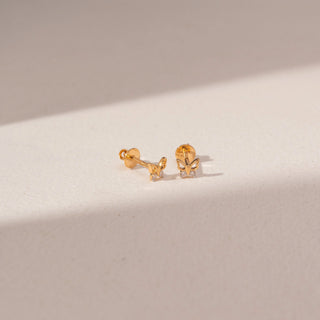 Angled view of Butterfly Diamond Earrings in 18KT Yellow Gold, featuring round lab-grown diamonds with butterfly designs.