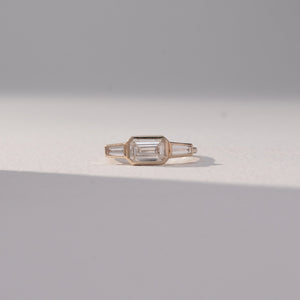 Emerald Tapered Trio Diamond Ring