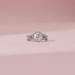 Front view of Round Halo Diamond Ring in 14KT White Gold, featuring a round diamond with a pavé halo and split shank.