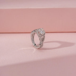 Angled view of Round Halo Diamond Ring in 14KT White Gold, featuring a round diamond with a pavé halo and split shank.