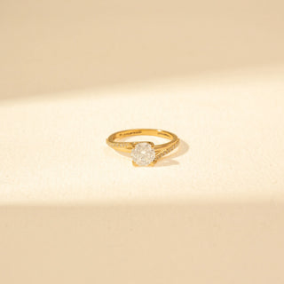 Front view of Round Solitaire Diamond Ring in 14KT Yellow Gold, featuring a round brilliant-cut diamond and pavé-set curved bands.
