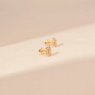 Side view of Sunburst Diamond Stud Earrings in 14KT Yellow Gold, featuring a floral design with baguette and round diamonds.