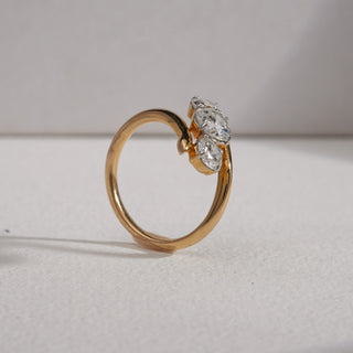Side view of the Asymmetric Threefold Gold Diamond Ring in 18KT yellow gold, showcasing three EF colour, VVS clarity round diamonds with a 1.01-carat solitaire at the centre. The sleek open band curves elegantly around the stones, weighing 4.52 grams, with a total diamond weight of 1.9 carats.