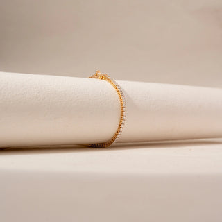 Side view of Diamond Tennis Bracelet in 14KT Yellow Gold, featuring a continuous row of round lab-grown diamonds.