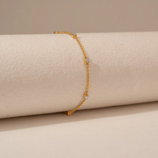 Side view of Delicate Station Diamond Chain Bracelet in 14KT Yellow Gold, featuring round lab-grown diamond stations.