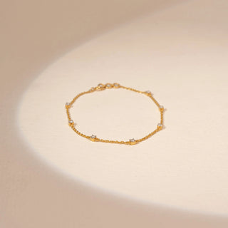 Top view of Delicate Station Diamond Chain Bracelet in 14KT Yellow Gold, featuring round lab-grown diamond stations.