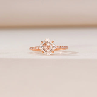 Front view of Kite Set Asscher Diamond Ring in rose gold, featuring a kite-oriented Asscher-cut lab-grown diamond with pavé diamond accents along the band, displayed on a soft beige backdrop.