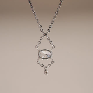 Close-up front view of Dainty Infinity Solitaire Drop Necklace in white gold, highlighting the solitaire oval diamond centerpiece framed within an infinity-inspired drop design, crafted in 14 KT gold with EF colour, VVS clarity diamonds.