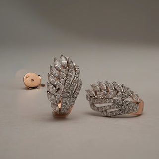 Close-up of Statement Vine Cluster diamond earrings in 14KT Rose Gold, featuring layered marquise and round EF-VVS lab-grown diamonds arranged in vine-like trails with intricate detailing.