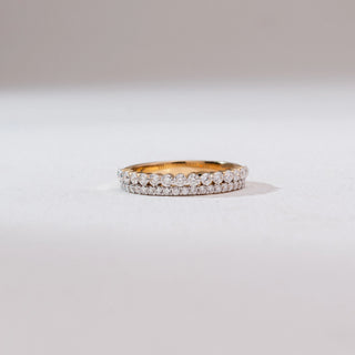 Front view of the Double Row Shimmering Diamond Ring in 14KT yellow gold, featuring two parallel rows of round brilliant diamonds—one larger and one pavé-set—forming a layered band on a neutral background.