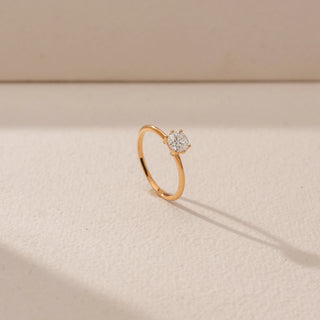 Angled view of Round Solitaire Diamond Ring in 14KT Yellow Gold, featuring a round lab-grown diamond in a prong setting.