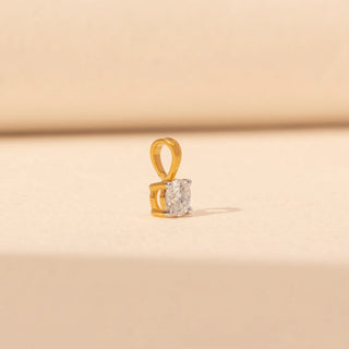 Side view of Solitaire Diamond Pendant in 14KT Yellow Gold, featuring a round lab-grown diamond in a four-prong setting.