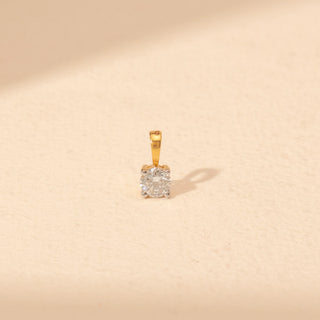 Top view of Solitaire Diamond Pendant in 14KT Yellow Gold, featuring a round lab-grown diamond in a four-prong setting.