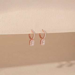 Side view of Emerald-Cut Diamond Drop Earrings in 14KT Rose Gold, featuring rectangular emerald-cut diamonds with pavé halos.