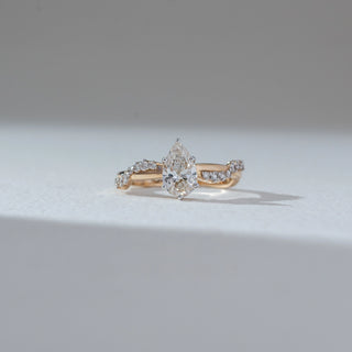 Front view of Marquise Solitaire Diamond Ring in 14KT Yellow Gold, featuring a centred marquise lab grown diamond with pavé accents. Set on a neutral backdrop, the design highlights elegance and brilliance.
