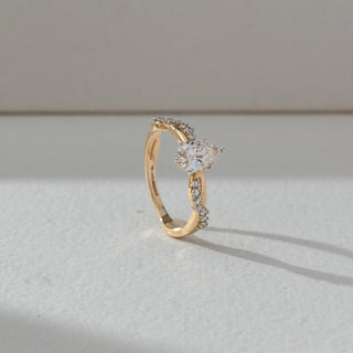 Side view of Marquise Solitaire Diamond Ring in 14KT Yellow Gold, featuring a centred marquise lab grown diamond with pavé accents. Set on a neutral backdrop, the design highlights structure and elegance.
