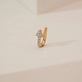 Side angle view of yellow gold clover cluster diamond nosepin featuring round lab-grown diamonds in a floral setting with a slim diamond-accented extension on a neutral studio background.