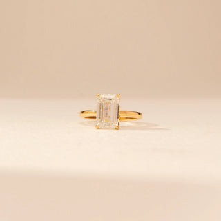 Front view of Dazzling Emerald Diamond Solitaire Ring in 14KT Yellow Gold, featuring an emerald-cut lab-grown diamond.
