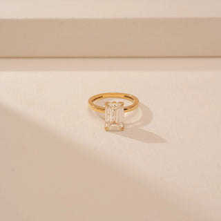 Top view of Dazzling Emerald Diamond Solitaire Ring in 14KT Yellow Gold, featuring an emerald-cut lab-grown diamond.
