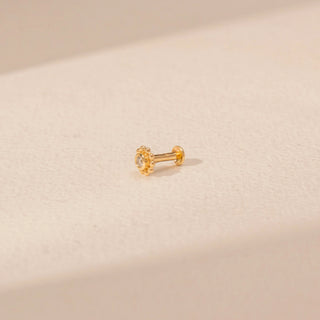 Angled  view of a floral diamond stud in 14KT yellow gold, featuring a round lab-grown diamond and beaded halo.