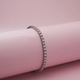 Close view of Classic Silver Tennis Diamond Bracelet in white gold, featuring a continuous row of round lab-grown diamonds wrapped around a soft pink display form, highlighting fluid brilliance and symmetry.