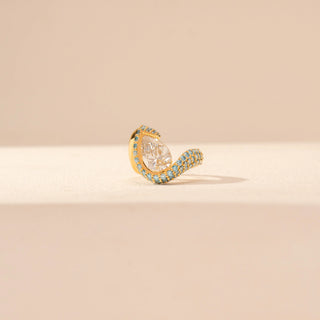 Front view of Pear-Cut Diamond Ring in 14KT Yellow Gold, featuring a pear-shaped centre diamond with blue gemstone accents.