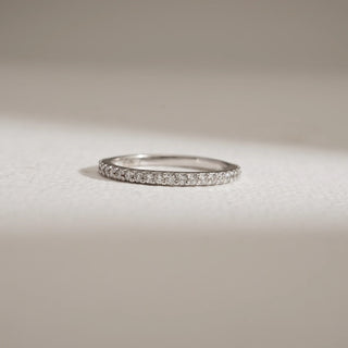 Close-up of 14KT White Gold Eternal Whisper Diamond Eternity Band with pavé-set EF VVS round diamonds, designed for timeless sparkle, stacking versatility, and everyday elegance.