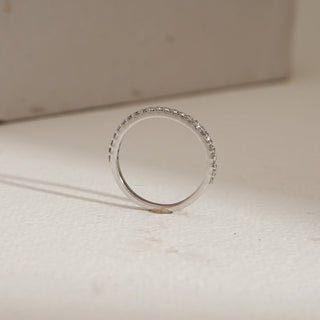 Side view of 14KT White Gold Eternal Whisper Diamond Eternity Band with EF VVS pavé-set round diamonds, showcasing delicate craftsmanship and timeless stacking elegance.