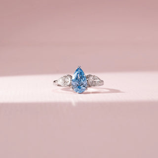 Front view of Blue Pear-Shaped Diamond Ring in 14KT White Gold, featuring a blue pear-cut centre diamond and diamond side stones.