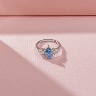 Top view of Blue Pear-Shaped Diamond Ring in 14KT White Gold, featuring a blue pear-cut centre diamond and diamond side stones.